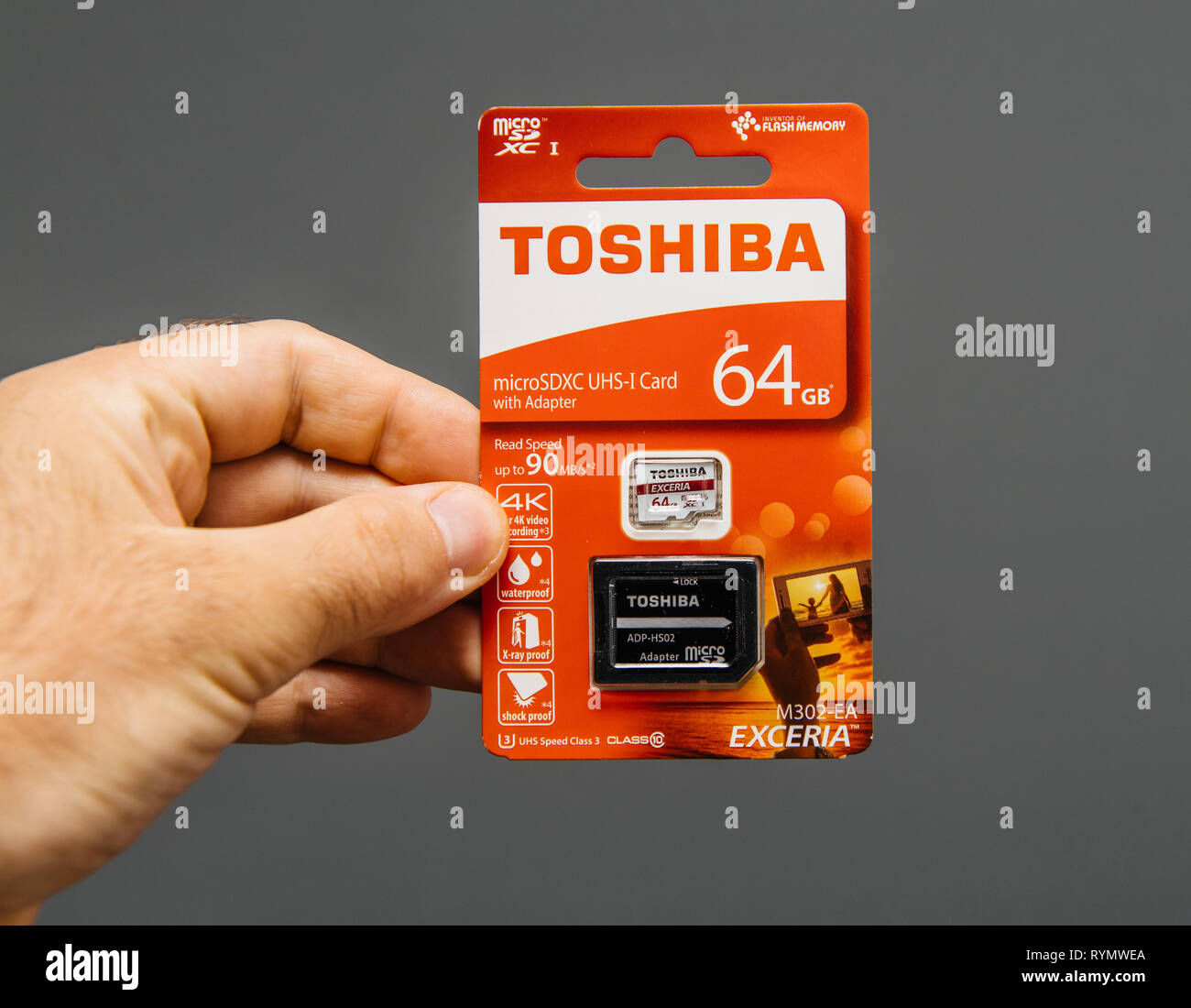 Paris, France - Jun 15, 2018: Man hand holding in hand a new Toshiba 64 gb  microSDXC UHS-i Card with adapter front view Stock Photo - Alamy