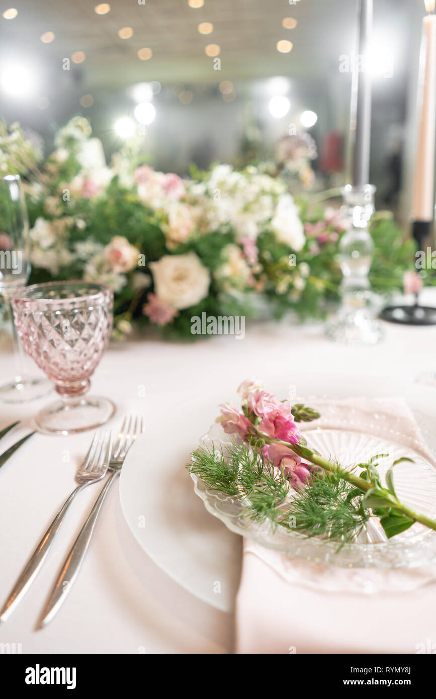Closeup Table setting with plates and tableware, adorned with flowers.  Floral decoration for wedding ceremony romance dining. Wedding banquet  Stock Photo - Alamy, image size:867x1390