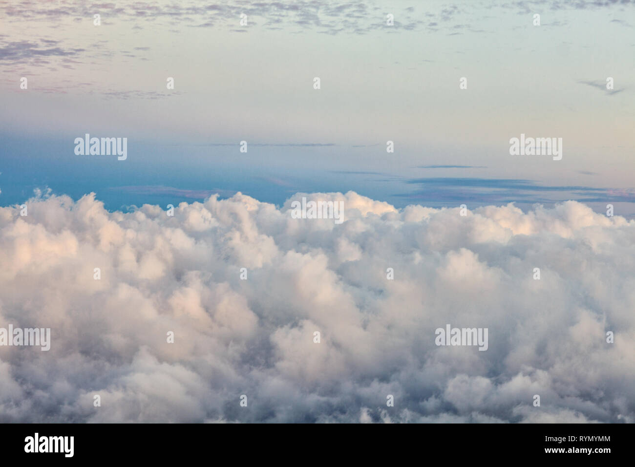 Tranquil View Of A Clear Blue And Pink Sky Above The Fluffy White Clouds Stock Photo Alamy