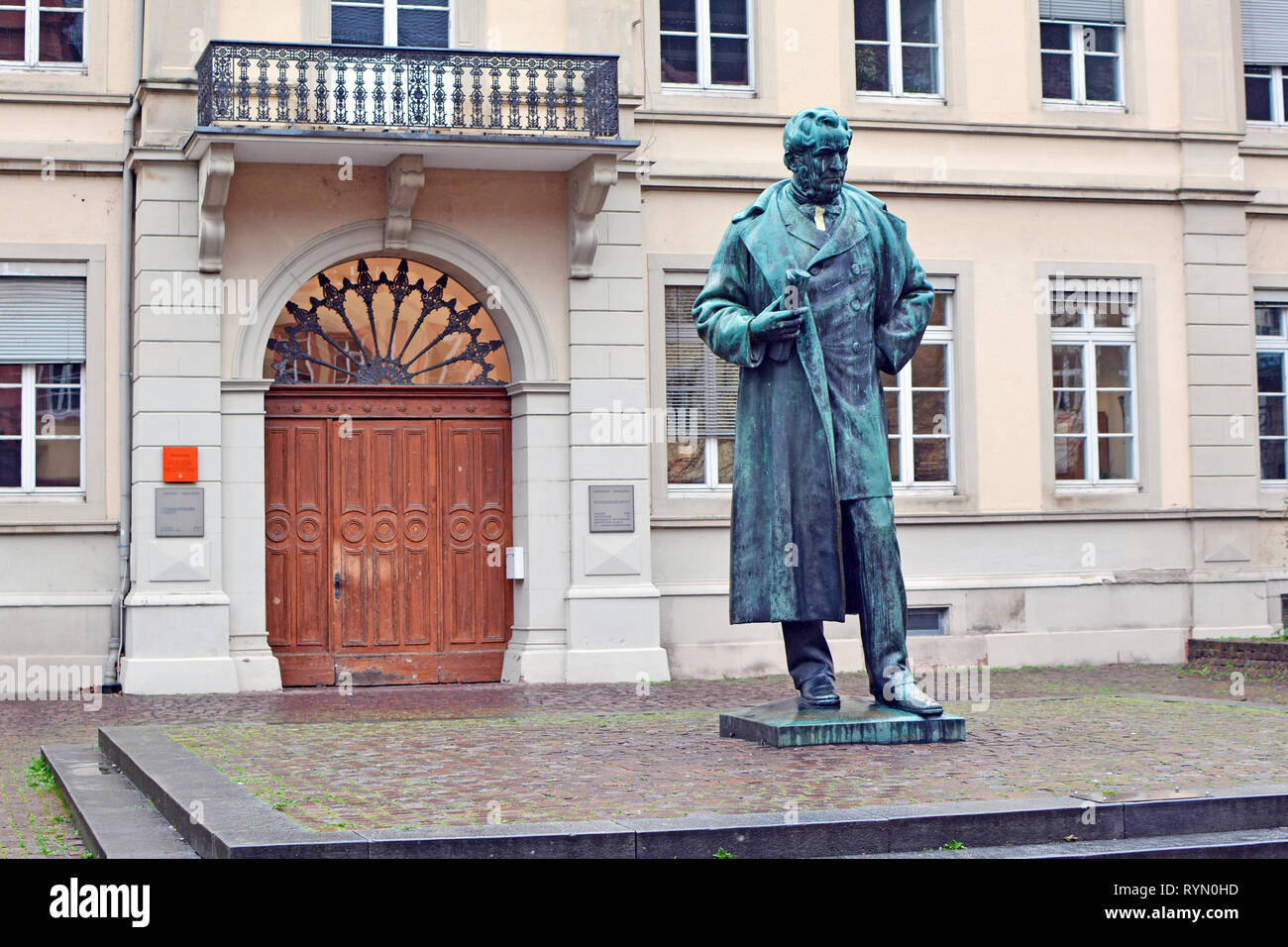 Robert Wilhelm Bunsen monument in front of historical Friedrichsbau university building in Heidelberg Stock Photo