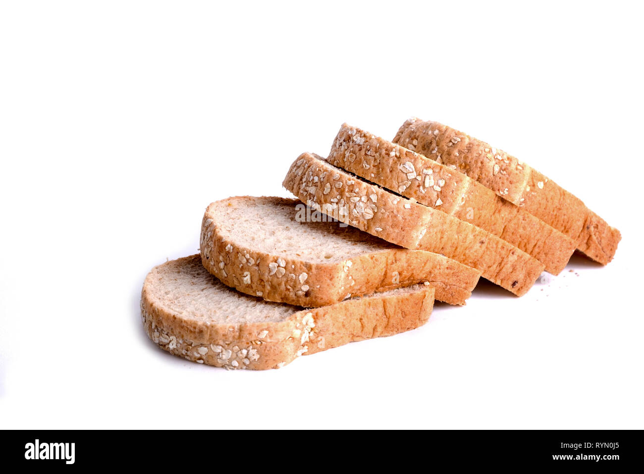 Slice whole wheat bread isolated on white background Stock Photo - Alamy