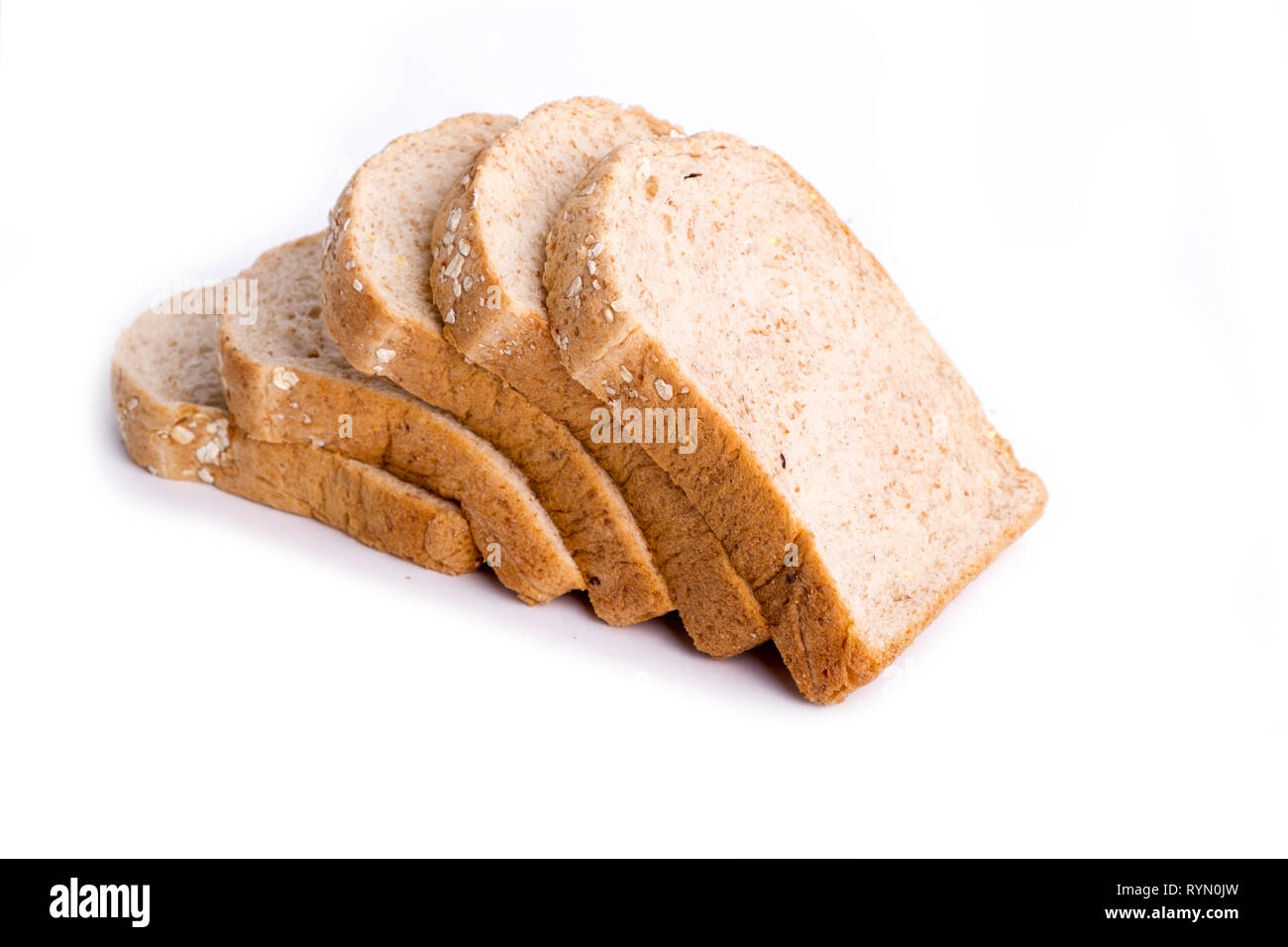 Slice whole wheat bread isolated on white background Stock Photo - Alamy