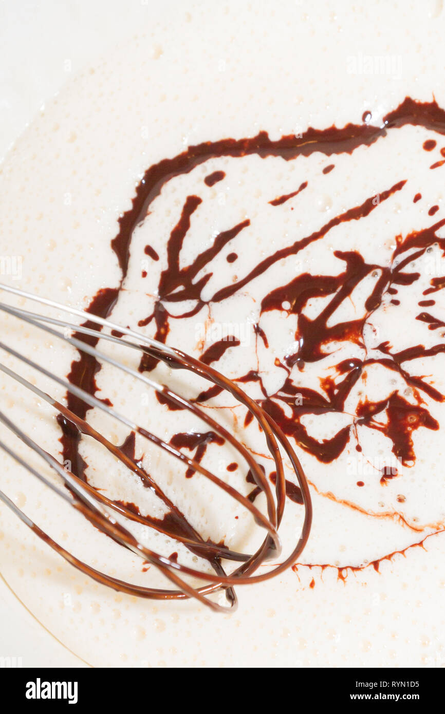 The melted cooled bitter chocolate is mixed with beaten eggs and sugar