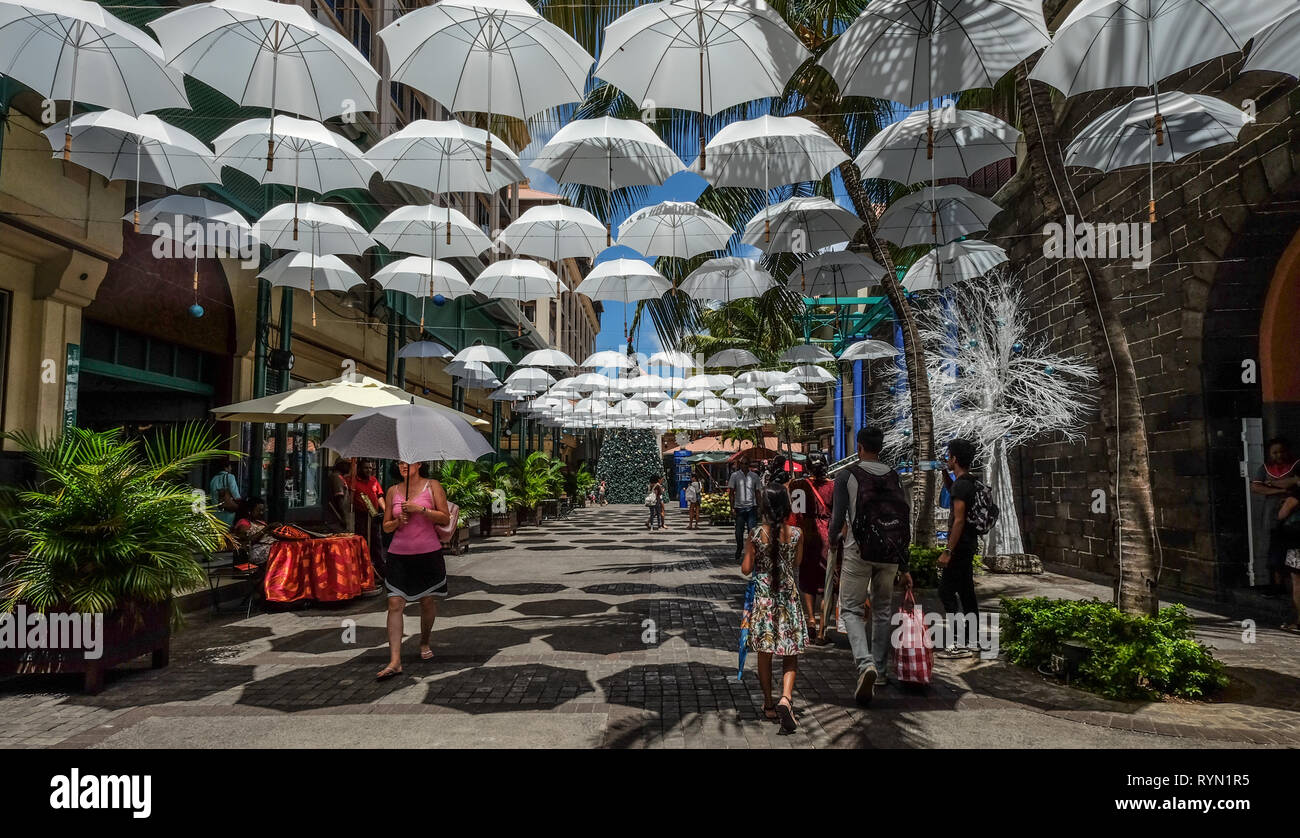 Port Louis, Mauritius Jan 4, 2017. White umbrellas urban street