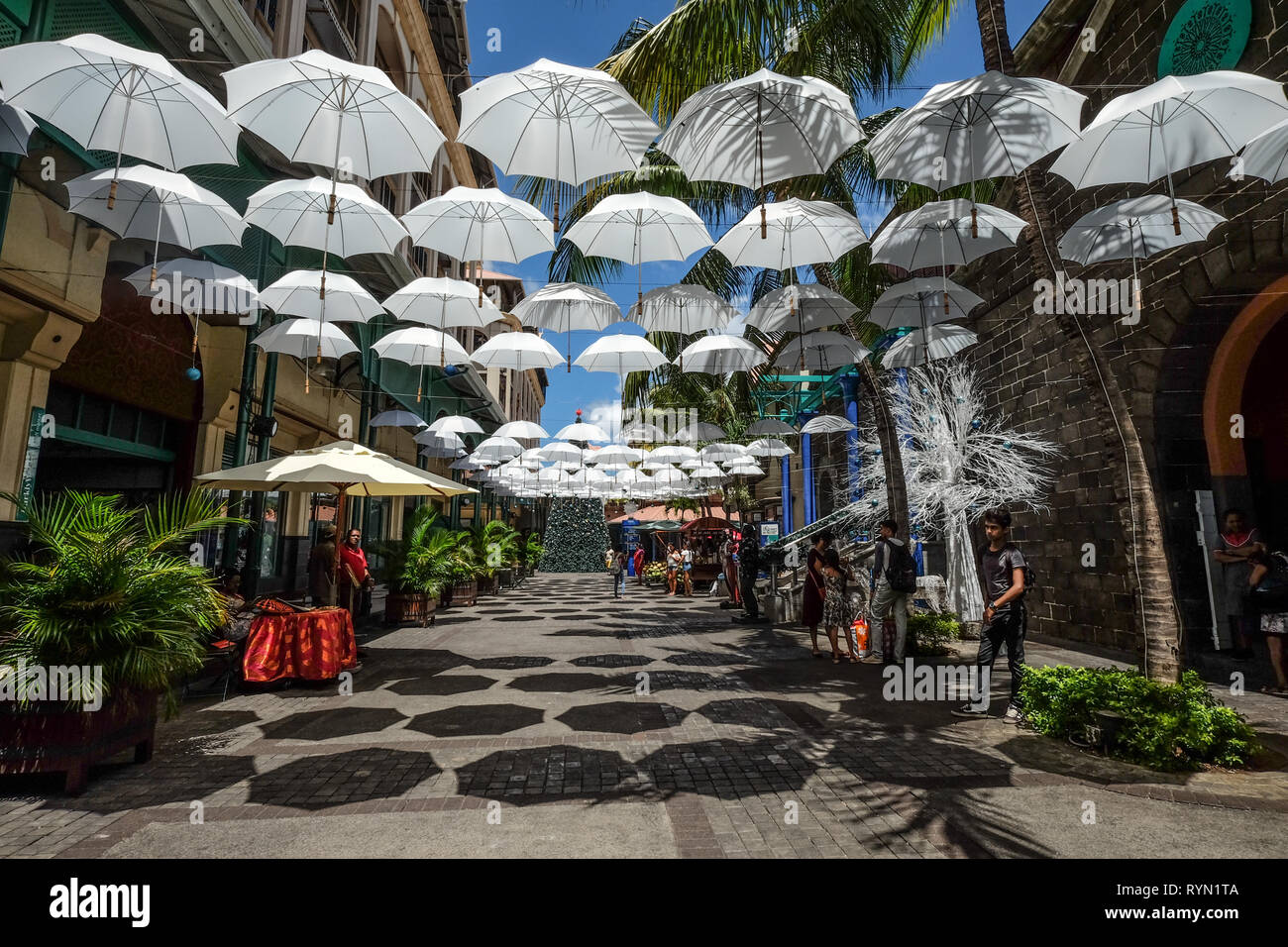 Port Louis, Mauritius Jan 4, 2017. White umbrellas urban street