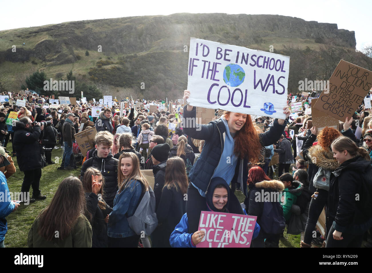 Students take part in a global school strike for climate change outside the Scottish Parliament building in Edinburgh, as protests are planned in 100 towns and cities in the UK. Stock Photo