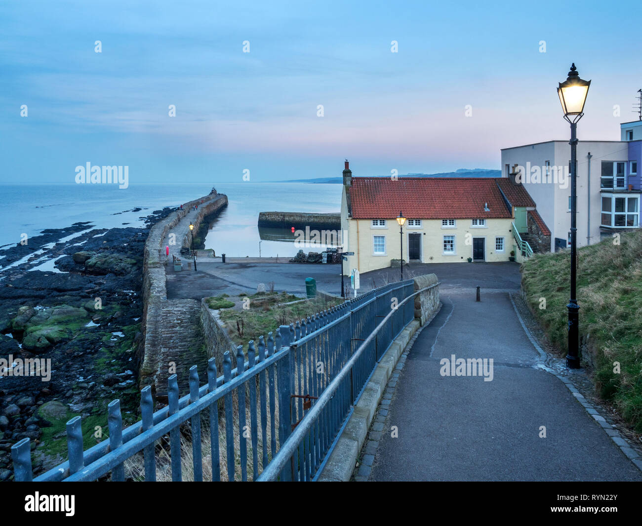 Path leading down to the Harbour at dusk St Andrews Fife Scotland Stock Photo