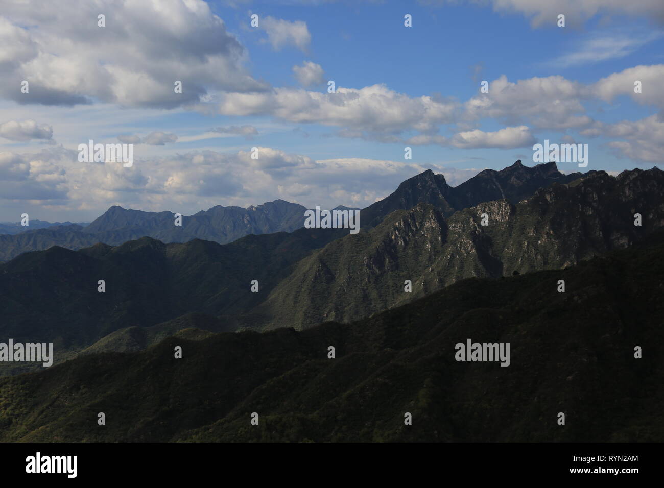 The Great Wall surrounding mountains at Mutianyu, Beijing, China Stock Photo