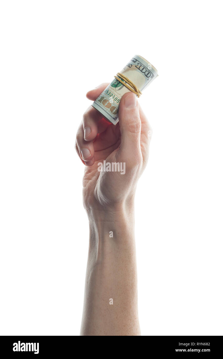 Man hand holding 100 Dollar bills isolated on white. Roll of US Dollars ban knote Stock Photo