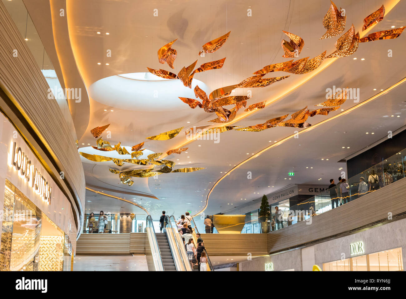 Bangkok, Thailand - December 15, 2018: an interior of Iconsiam Shopping Mall, a ceiling decoration above Louis Vuitton, Gems Pavilion and Dior stores. Stock Photo
