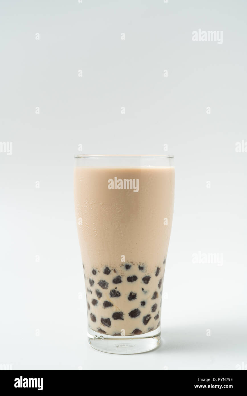 A glass cup of pearl milk tea (also called bubble tea) and a plate of  tapioca ball on white background. Pearl milk tea is the most representative  drin Stock Photo - Alamy