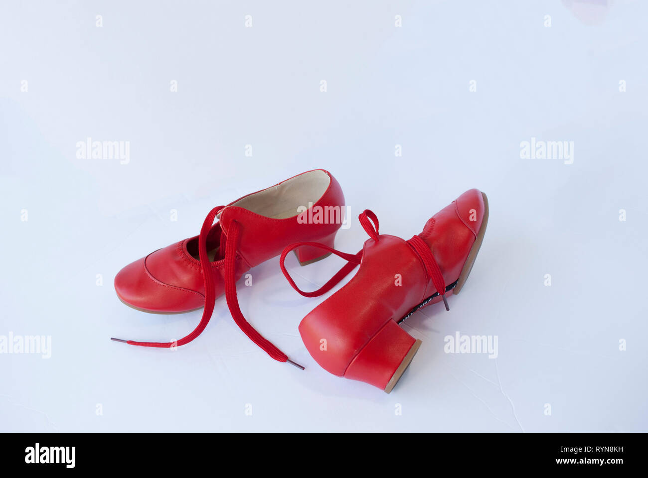 Red leather pair of shoes for female dancer. Traditional retro style footwear Stock Photo