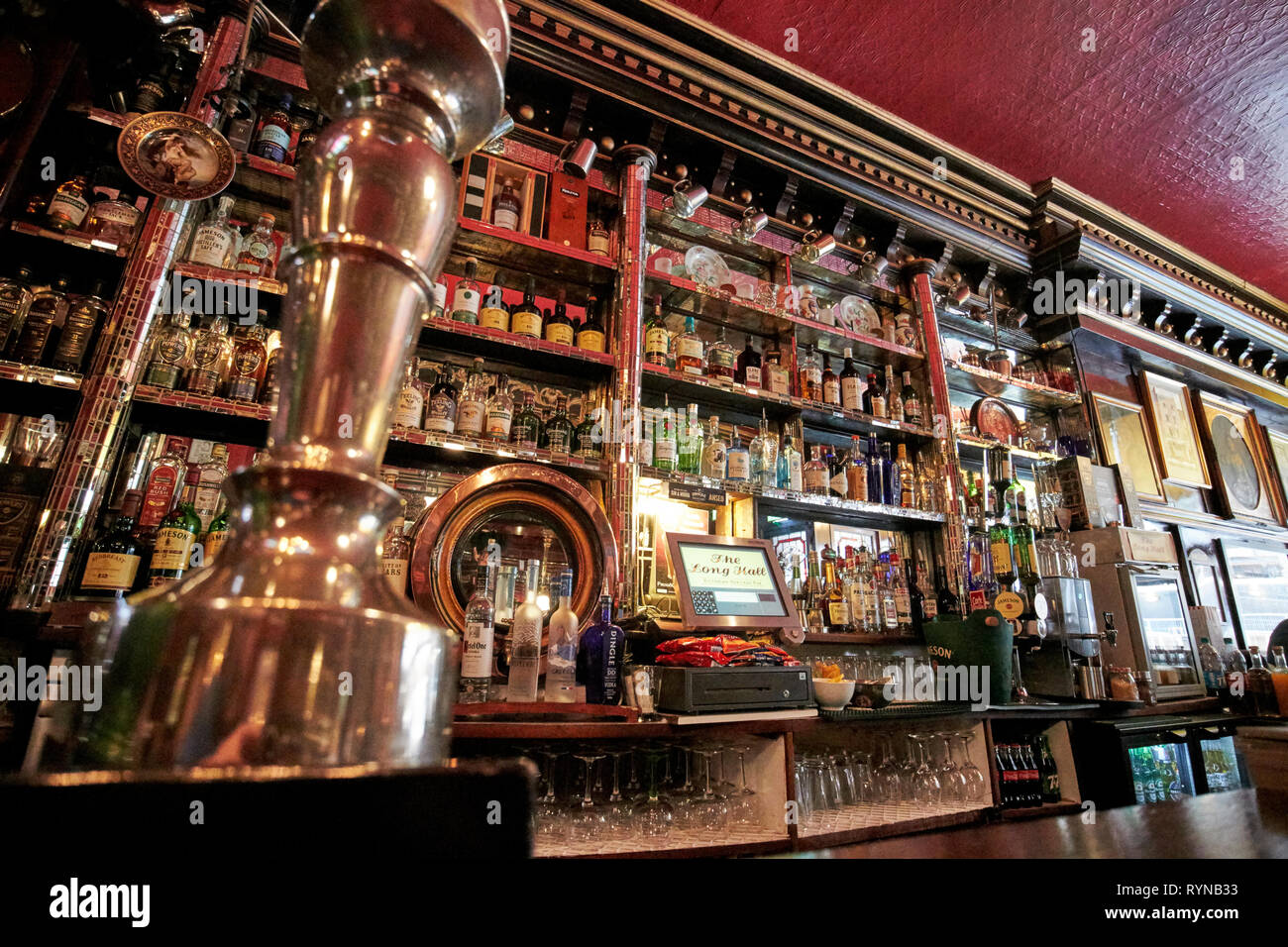 draft beer pumps in The Long Hall victorian pub one of the oldest pubs