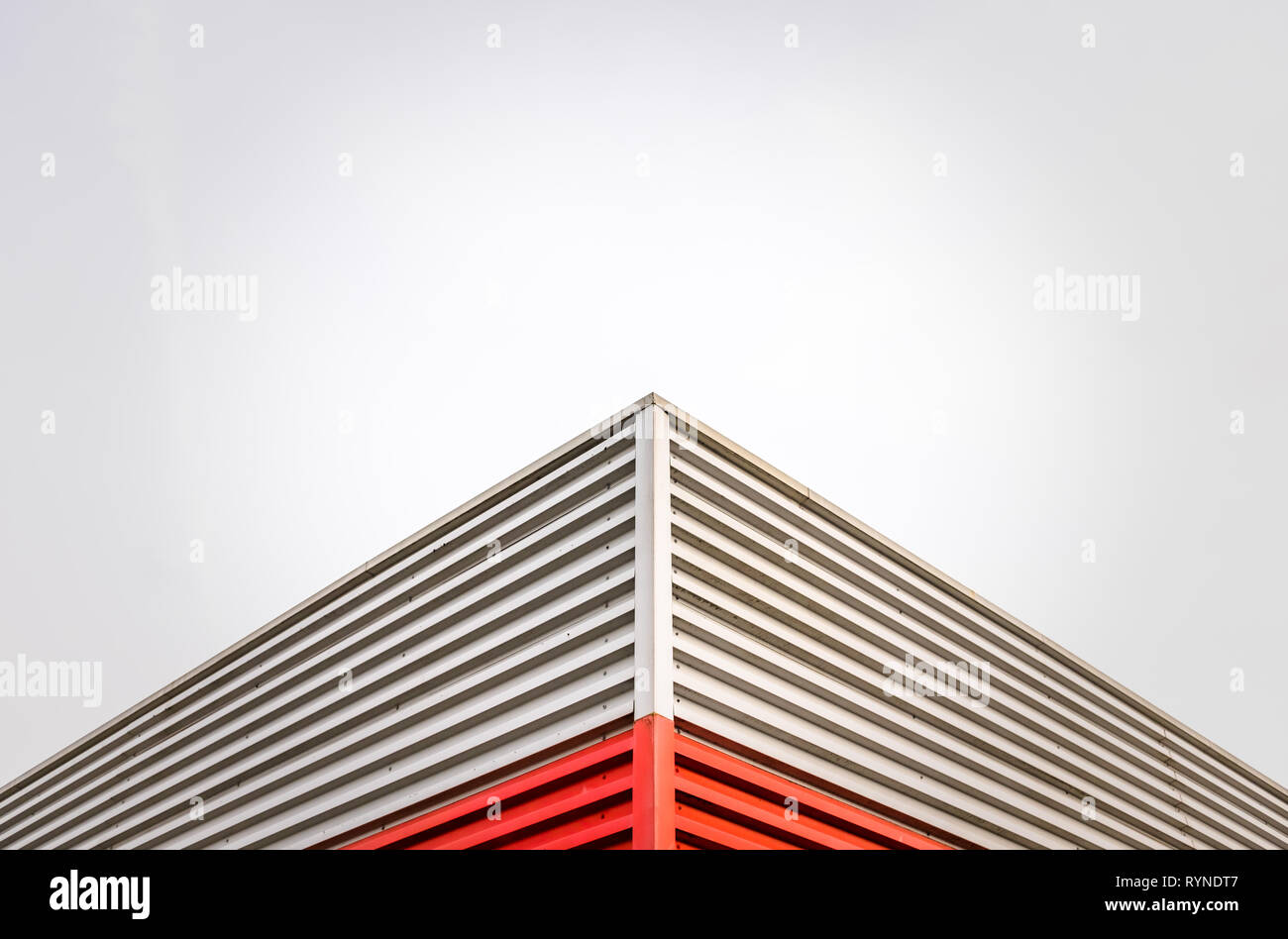 Abstract Architecture Detail Of A Factory Roof Corner Against An Overcast Sky With Copy Space Stock Photo