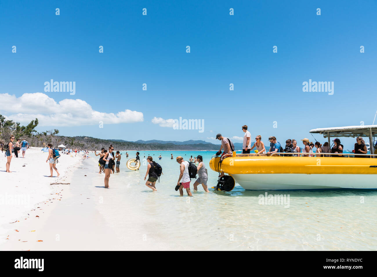 Hamilton Island, Australia - November 7, 2017: Tourists coming ashore on beautiful Whitehaven Beach in the Whitsundays, Queensland, Australia Stock Photo