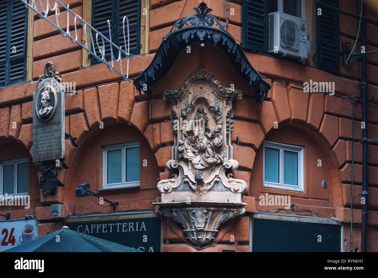 GENOA, ITALY - NOVEMBER 04, 2018 - Madonna shrine on the facade of the old house in Genoa Stock Photo