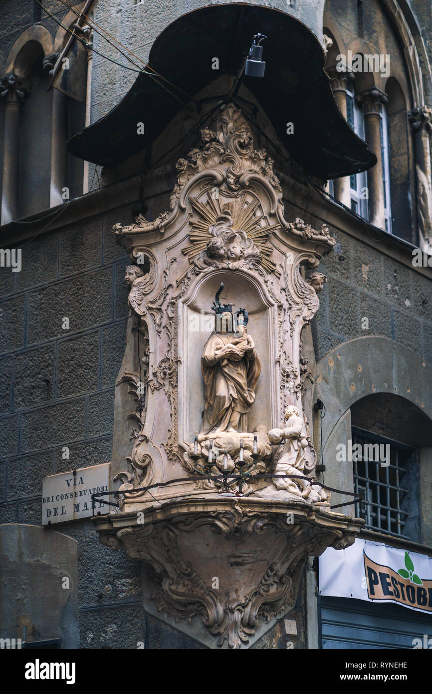 GENOA, ITALY - NOVEMBER 04, 2018 - Madonna shrine on the facade of the old house in Genoa Stock Photo