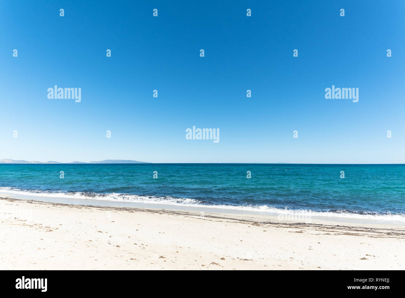 landscape of empty tropical beach with white sand and turquoise water Stock Photo