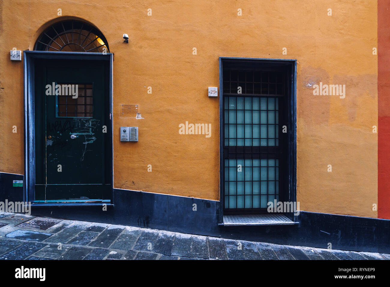 GENOA, ITALY - NOVEMBER 04, 2018 - Narrow streets of the old city with the doors Stock Photo