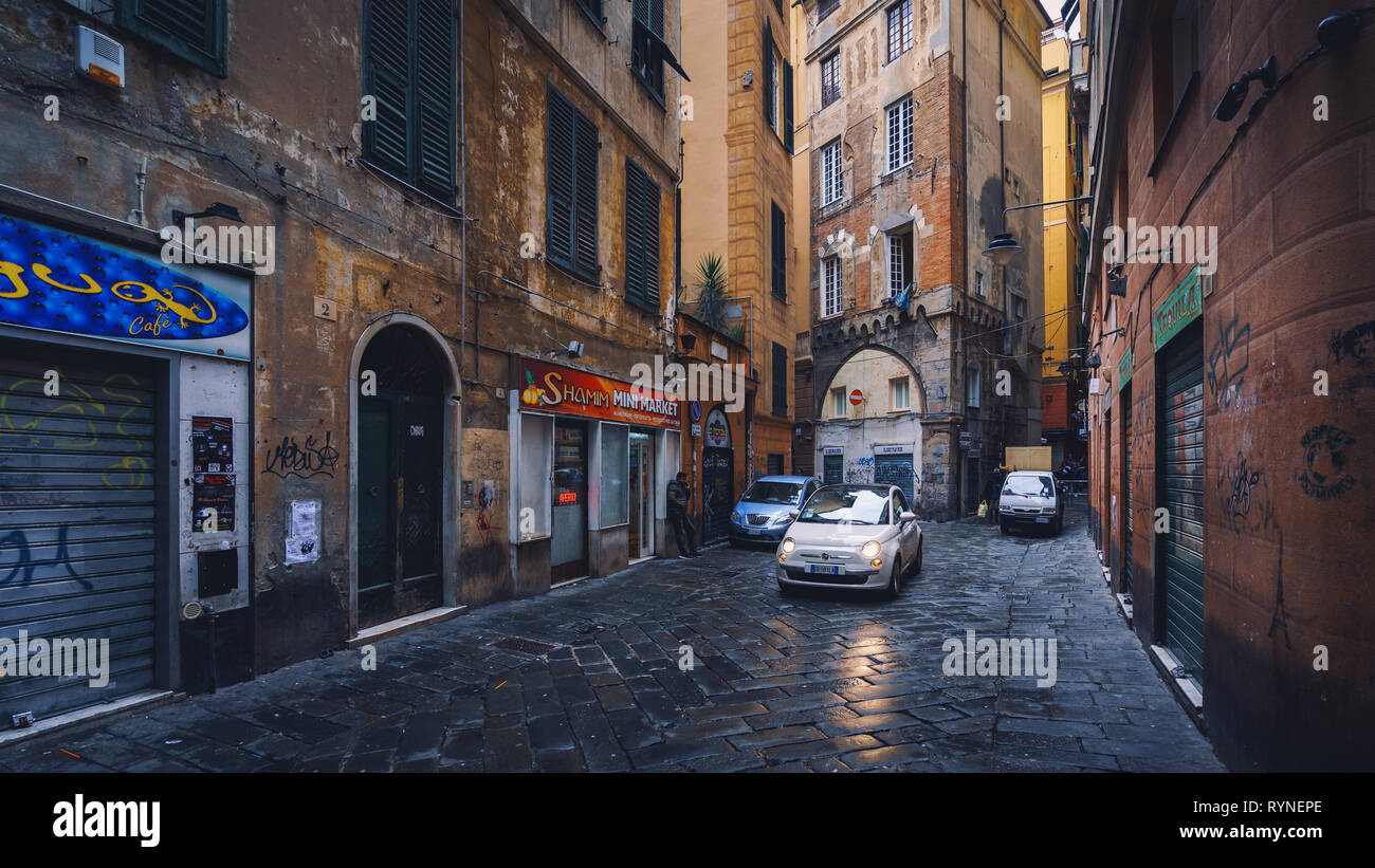 GENOA, ITALY - NOVEMBER 04, 2018 - Narrow streets of the old city with the cars Stock Photo