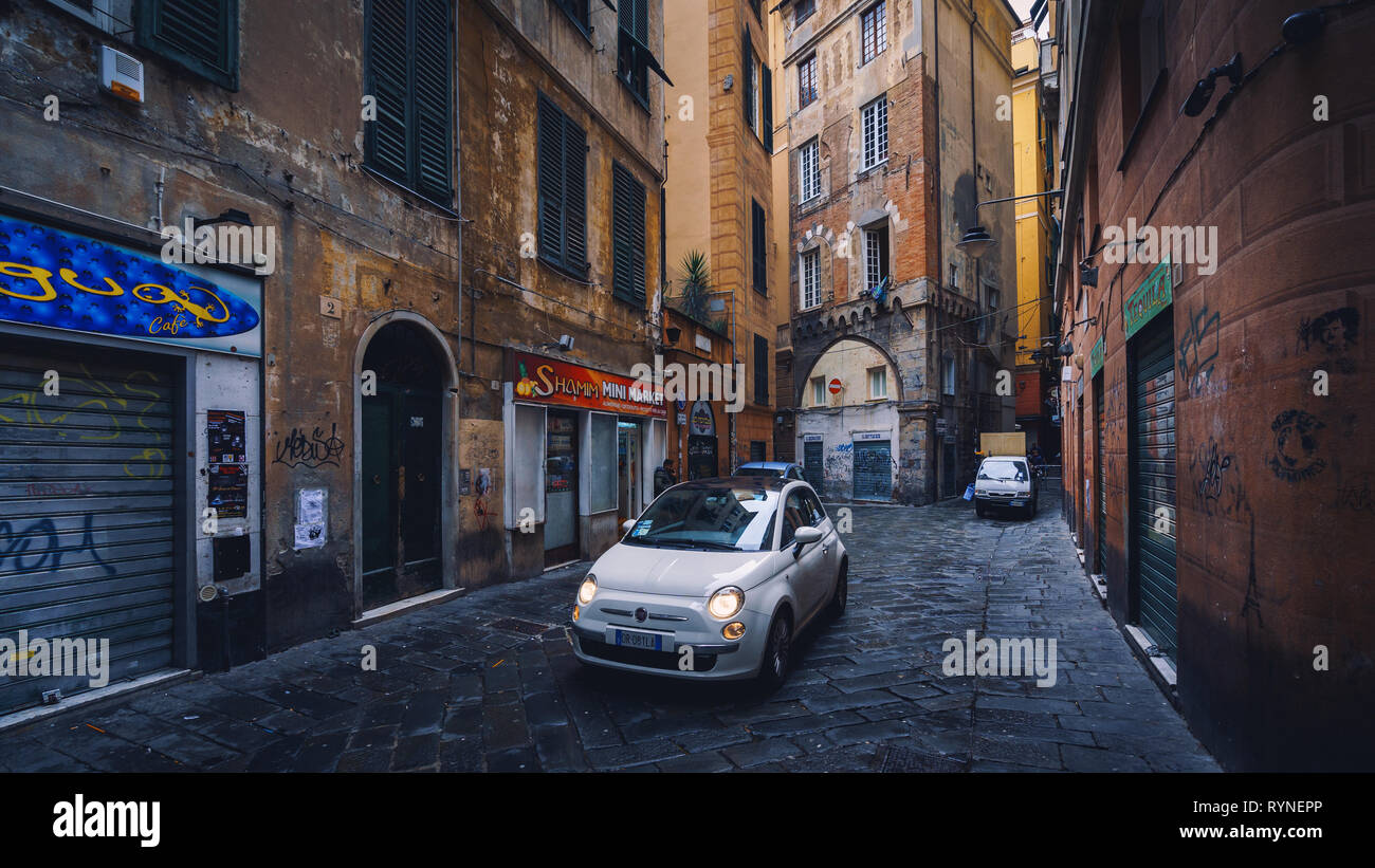 GENOA, ITALY - NOVEMBER 04, 2018 - Narrow streets of the old city with the cars Stock Photo