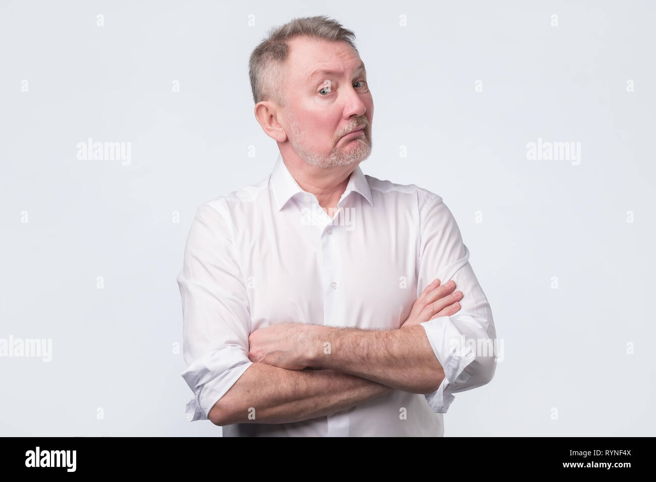 Doubtful senior man looking with disbelief expression. Stock Photo