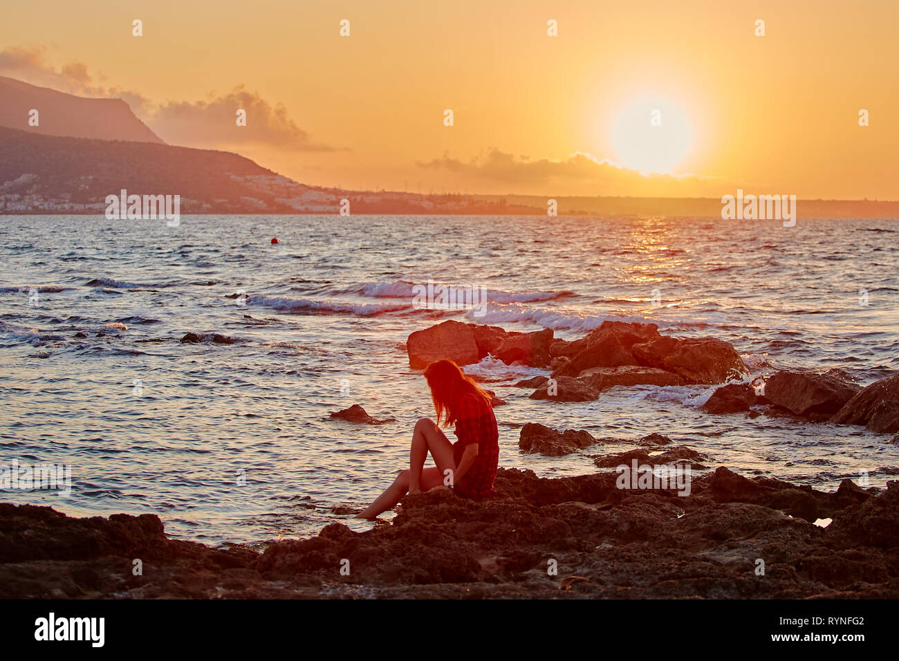 Profile Of A Woman Silhouette Watching Sun On The Beach At Sunset