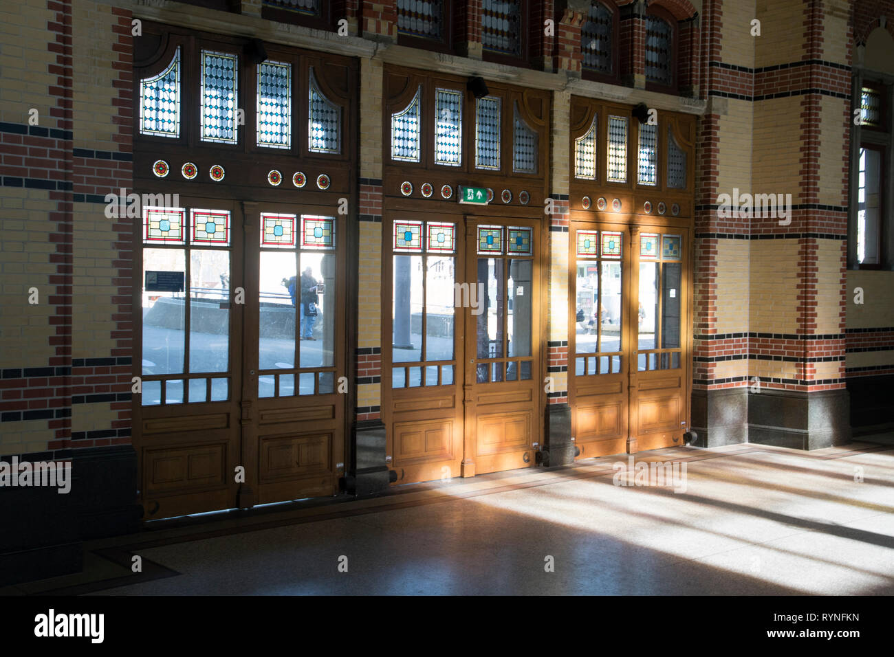 Old Wooden Swinging Doors With The Reflections Of The Sun Old