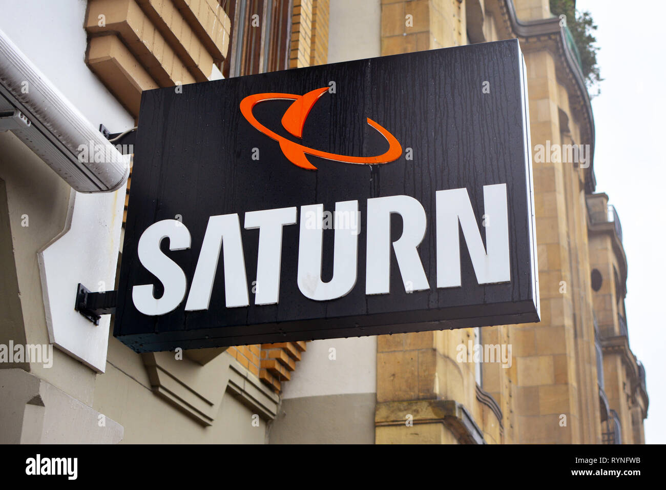 Store sign of German multinational chain of stores selling consumer electronics called 'Saturn' in Heidelberg Stock Photo