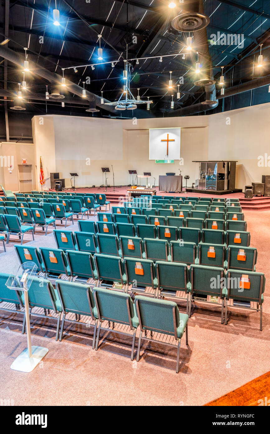 Vertical shot of a church auditorium from the back facing toward the stage looking from the right side of the sanctuary. Stock Photo