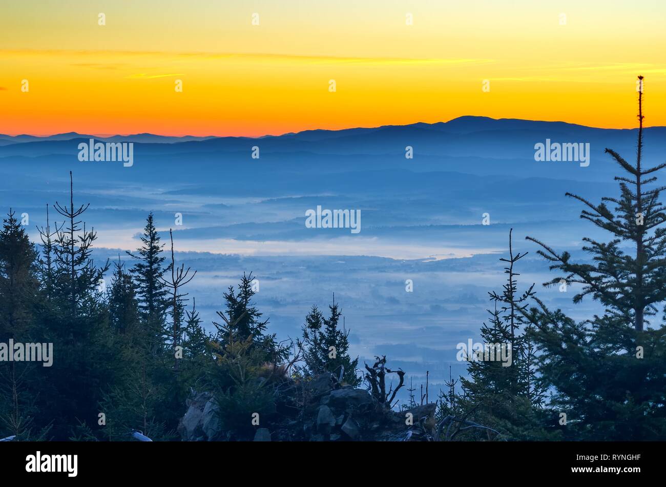 Beautiful morning autumnal mountain landscape. Impressive sunrise over the peaks of the mountains. Stock Photo