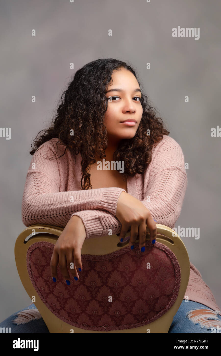 Image Of Cute Teenage Girl With Long Flowing Hair And Arms Crossed