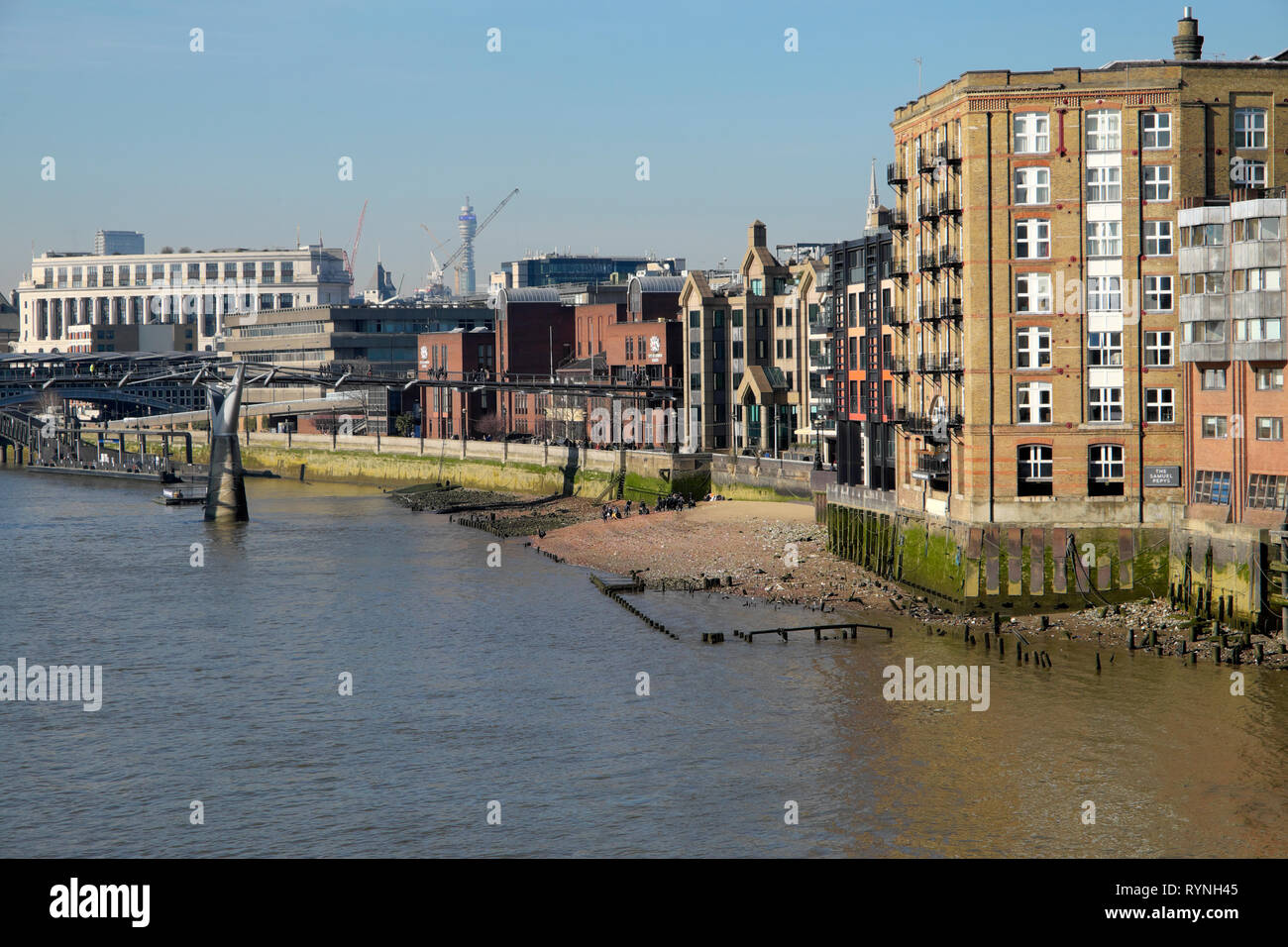 View of buildings along the north side of the River Thames riverwalk near the ancient dock of Queenhithe in City of London England UK  KATHY DEWITT Stock Photo