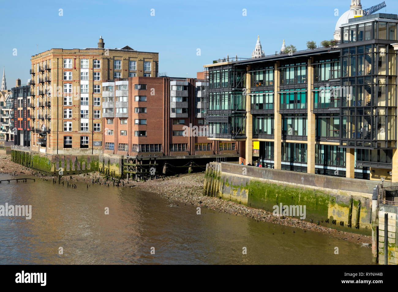 View of buildings along the north side of the River Thames riverwalk near the ancient dock of Queenhithe in City of London England UK  KATHY DEWITT Stock Photo