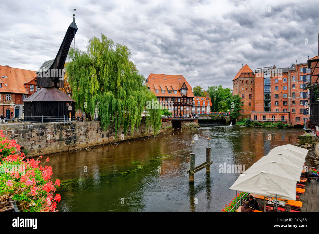 Lüneburg: Old harbour with historic crane, river Ilmenau, Lower Saxony, Germany Stock Photo
