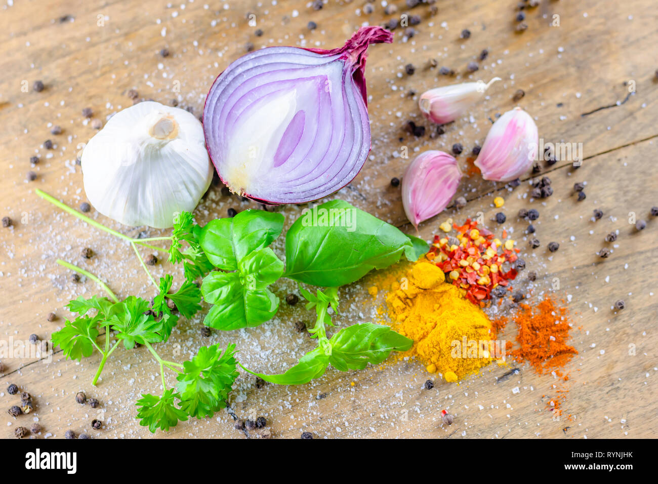 Food photography.Meal ingredients.Red onion, garlic bulbs, black pepper, freshly cut basil