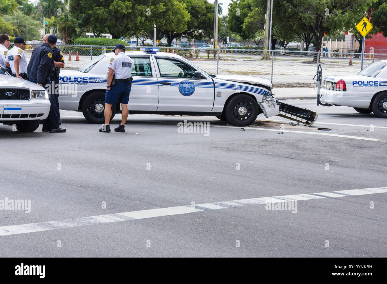 Miami Florida,City of Miami Police Department,car,police cruiser,collision,accident,fender,man men male,policeman,officer,FL090208006 Stock Photo