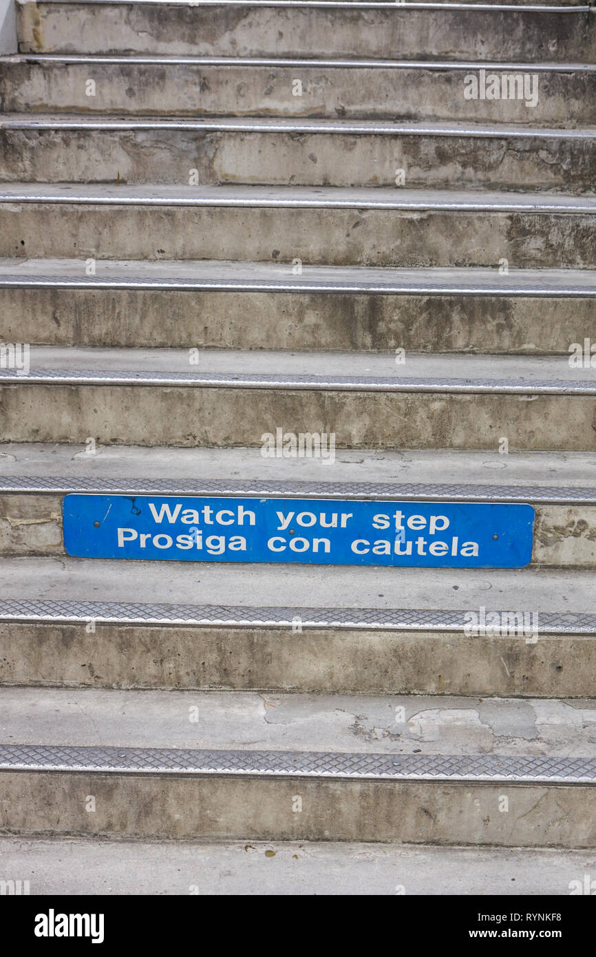 Miami Florida,downtown,Metromover Station,stairs,warning,safety,watch your step,bilingual,Spanish language,bilingual,prosiga con cautela,FL090208032 Stock Photo