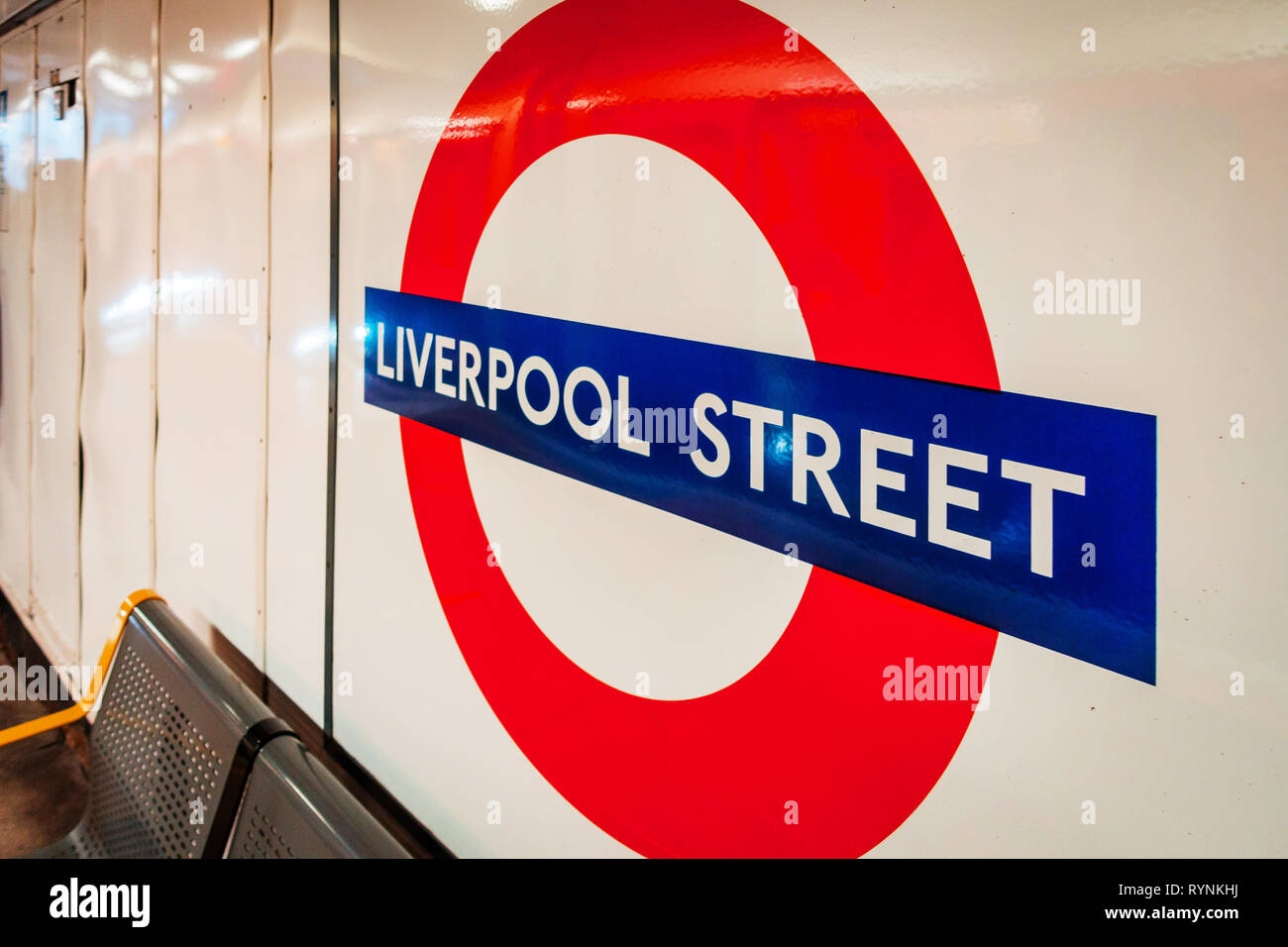 Iconic circular London Tube sign on the underground platform at
