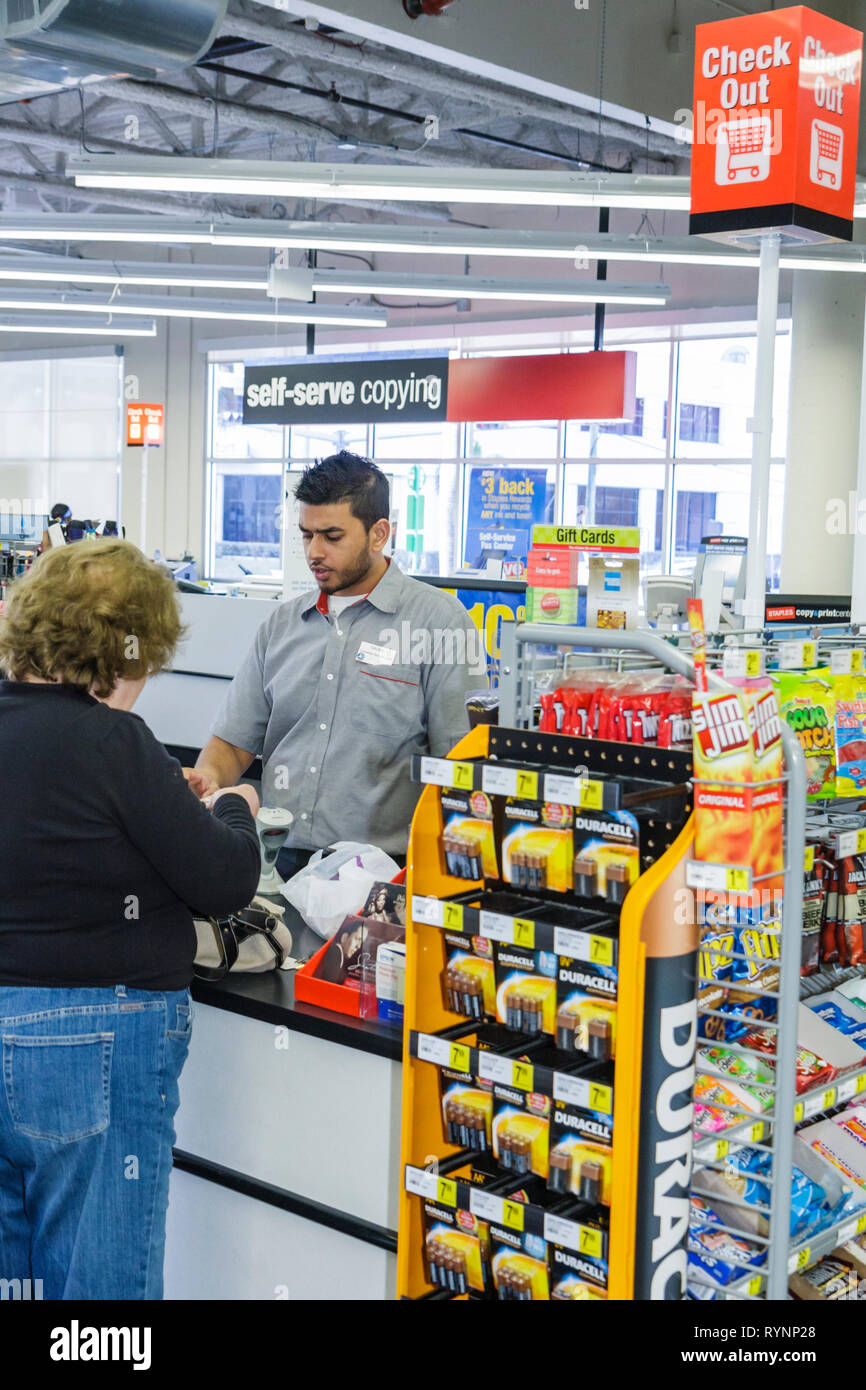 Miami Florida,Staples,office supply products store,chain,Hispanic man men male,woman female women,clerk,cashier,working,work,employee employees worker Stock Photo