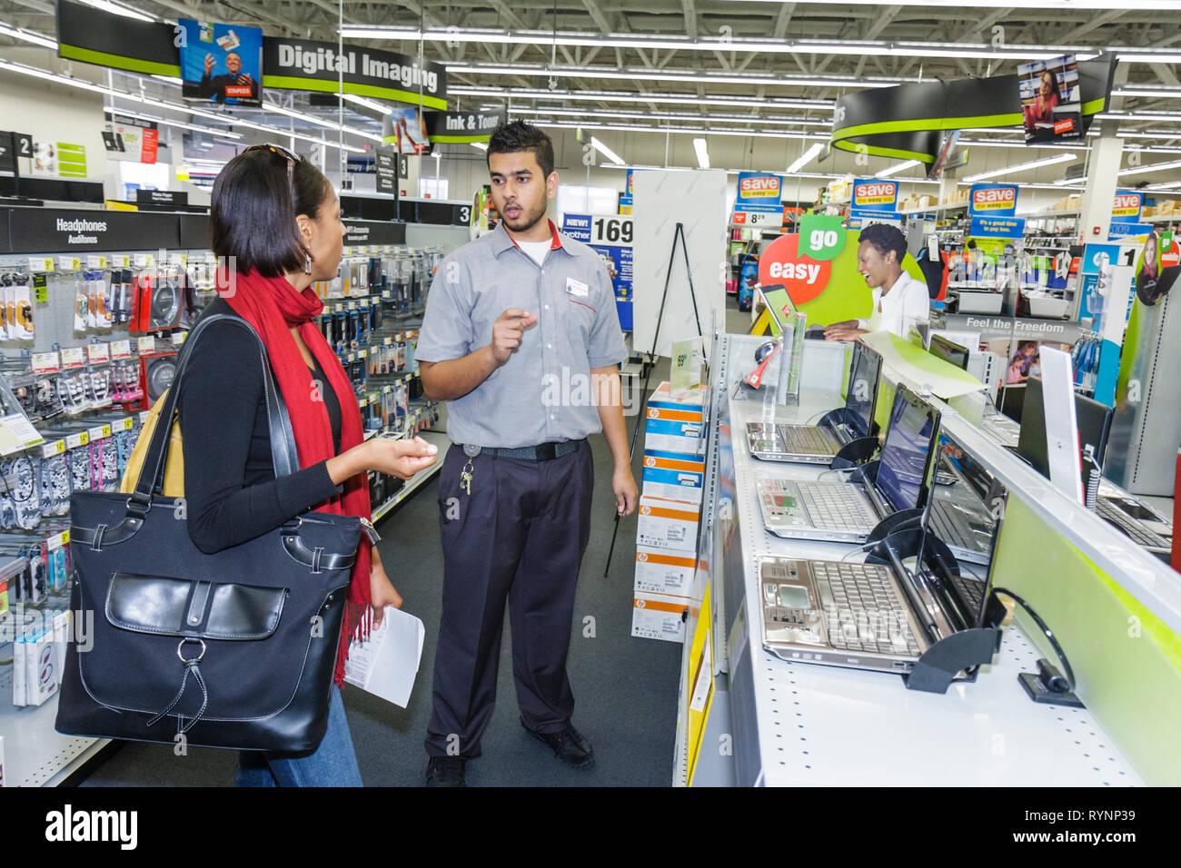 Miami Florida,Staples,office supply products store,chain,display sale laptop,notebook,computer,computer,Hispanic,Black African,man men male,woman fema Stock Photo