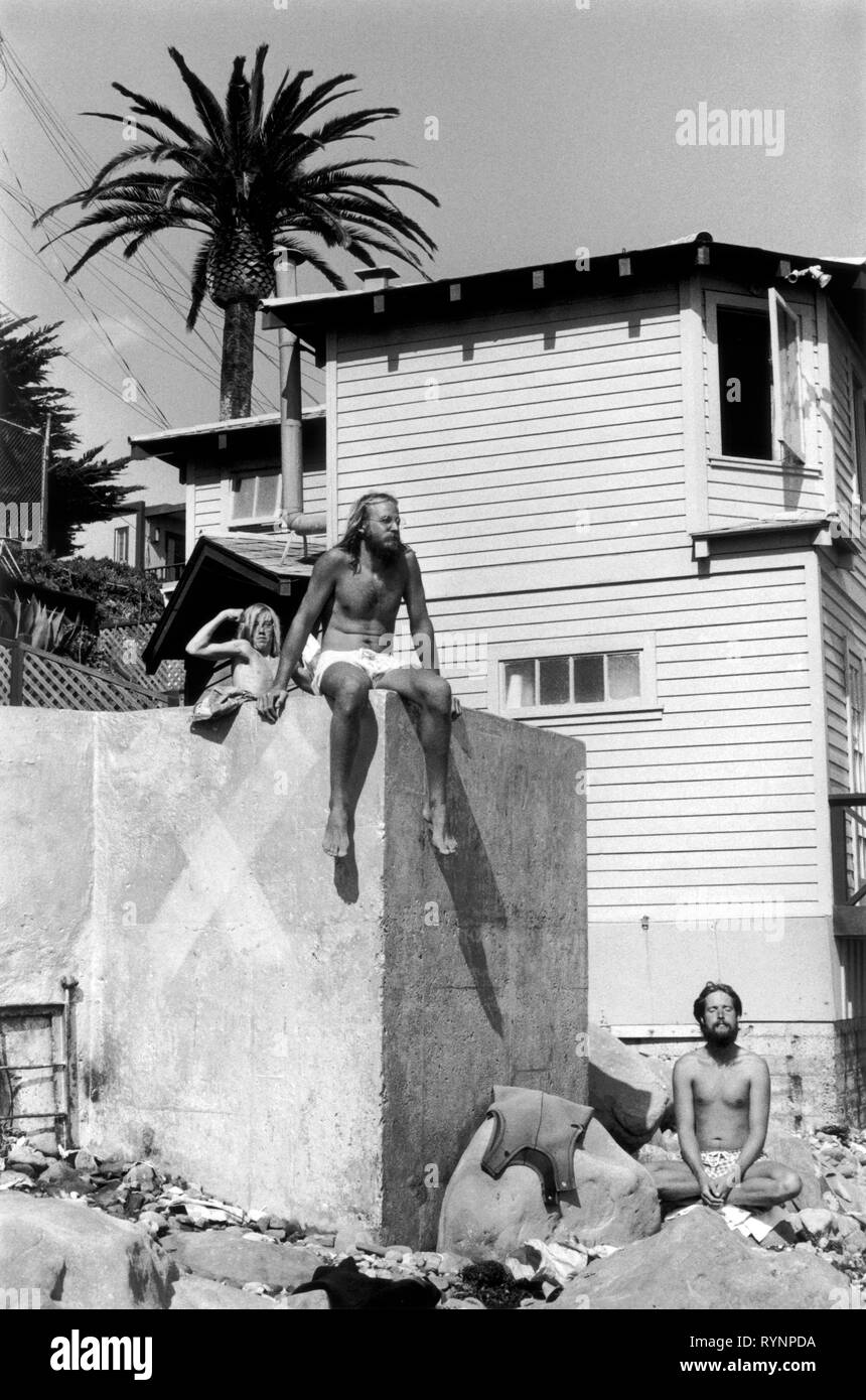 Santa Barbara California. 1970s beach boys, hippies and teenagers daily life Muscles, surfing and meditation 1971 USA . HOMER SYKES Stock Photo