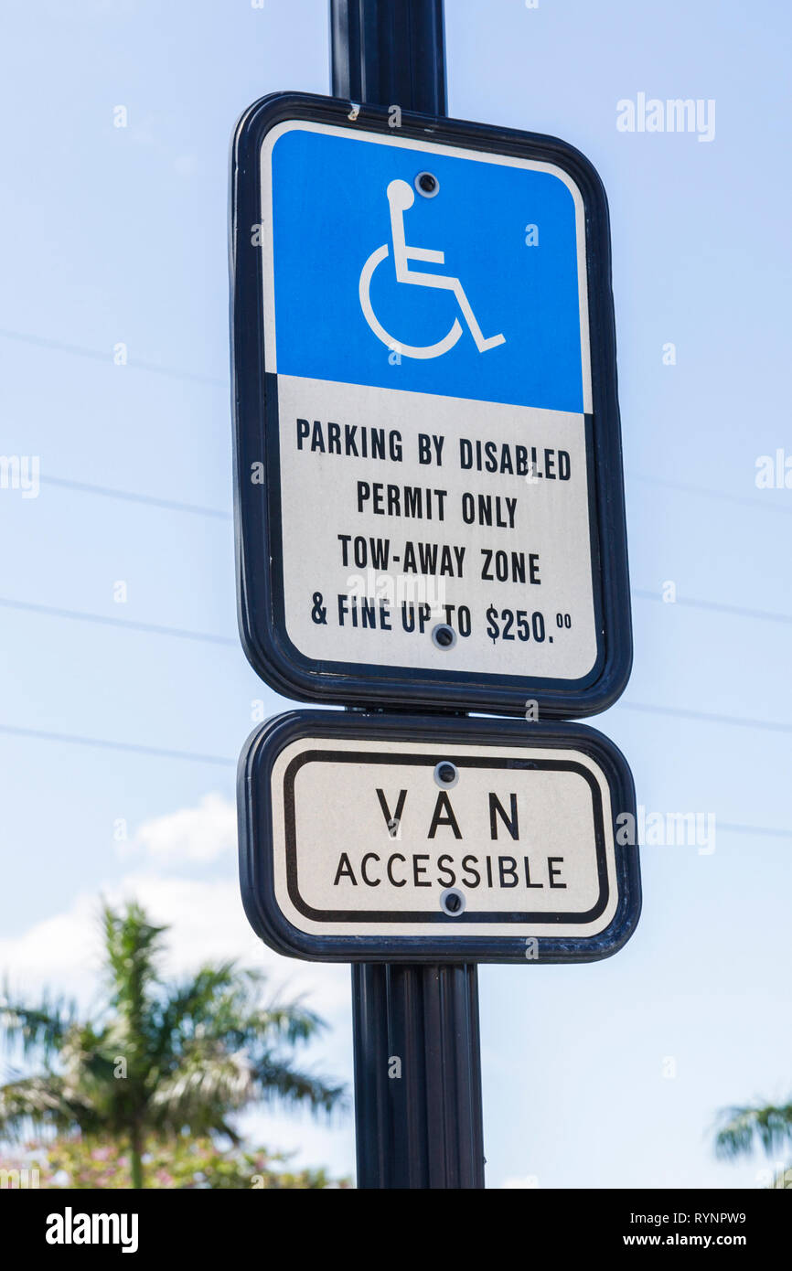 Florida Miramar,sign,blue,disabled parking,warning,fine,van accessible,$250,tow away,wheelchair,ADA,accessibility,handicapped,handicap,FL090228014 Stock Photo
