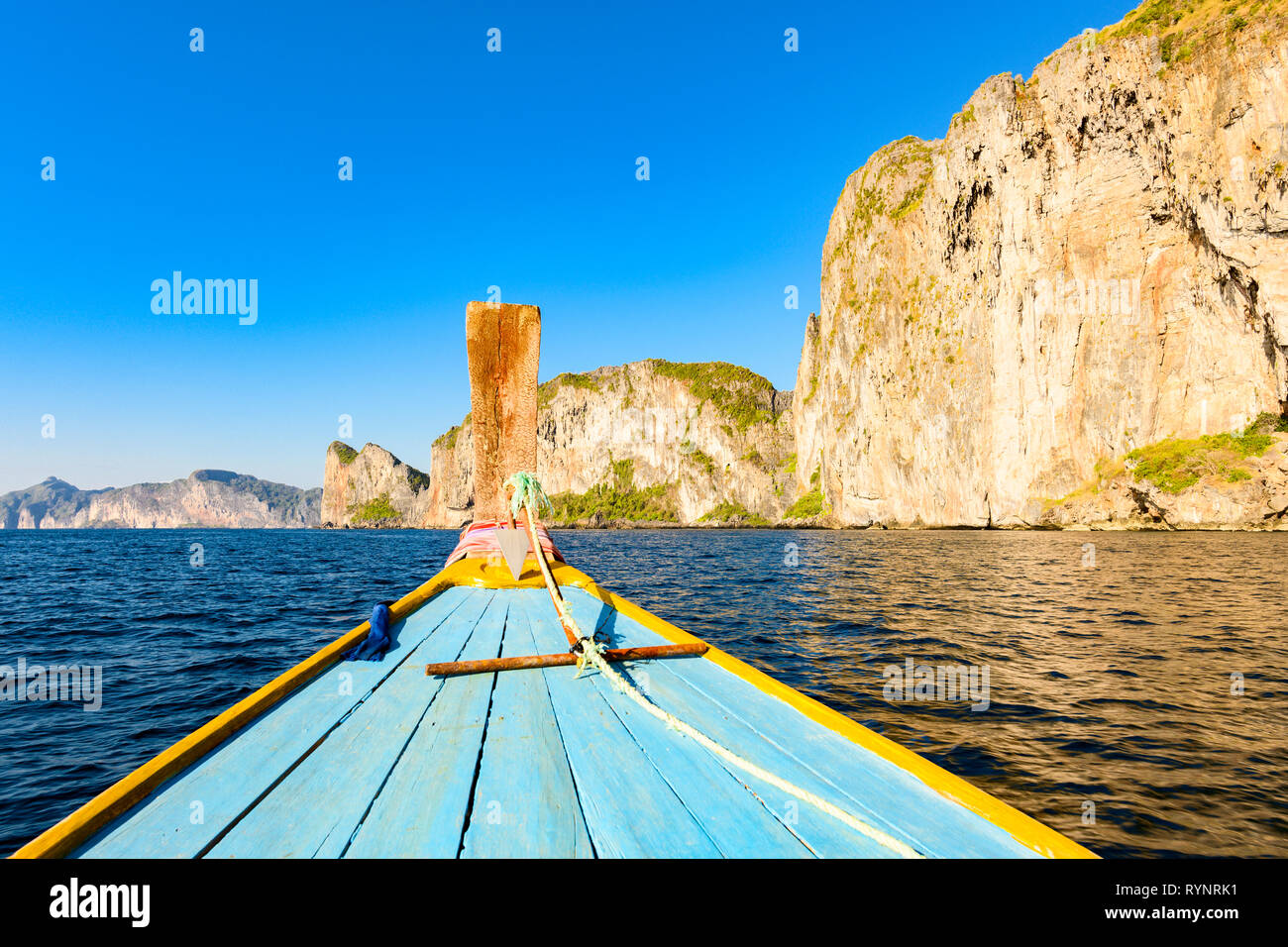 (selective focus) Stunning view of some limestone rock mountains surrounding the beautiful Maya Bay. Photo taken from a traditional long tail boat. Stock Photo