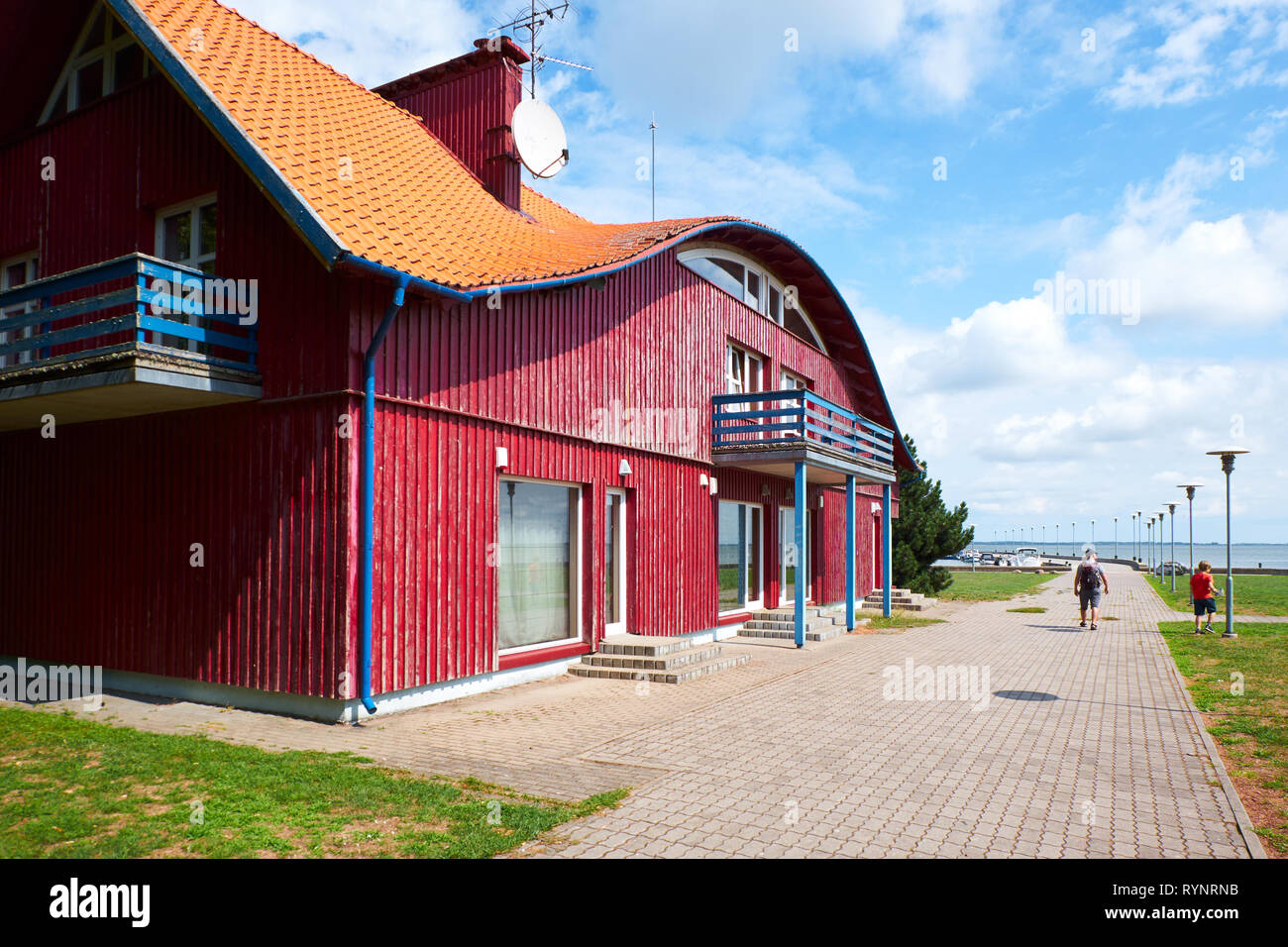 JUODKRANTE, LITHUANIA - AUGUST 06, 2018: Traditional wooden village house. Juodkrante is a resort town at Curonian Spit  in Lithuania Stock Photo