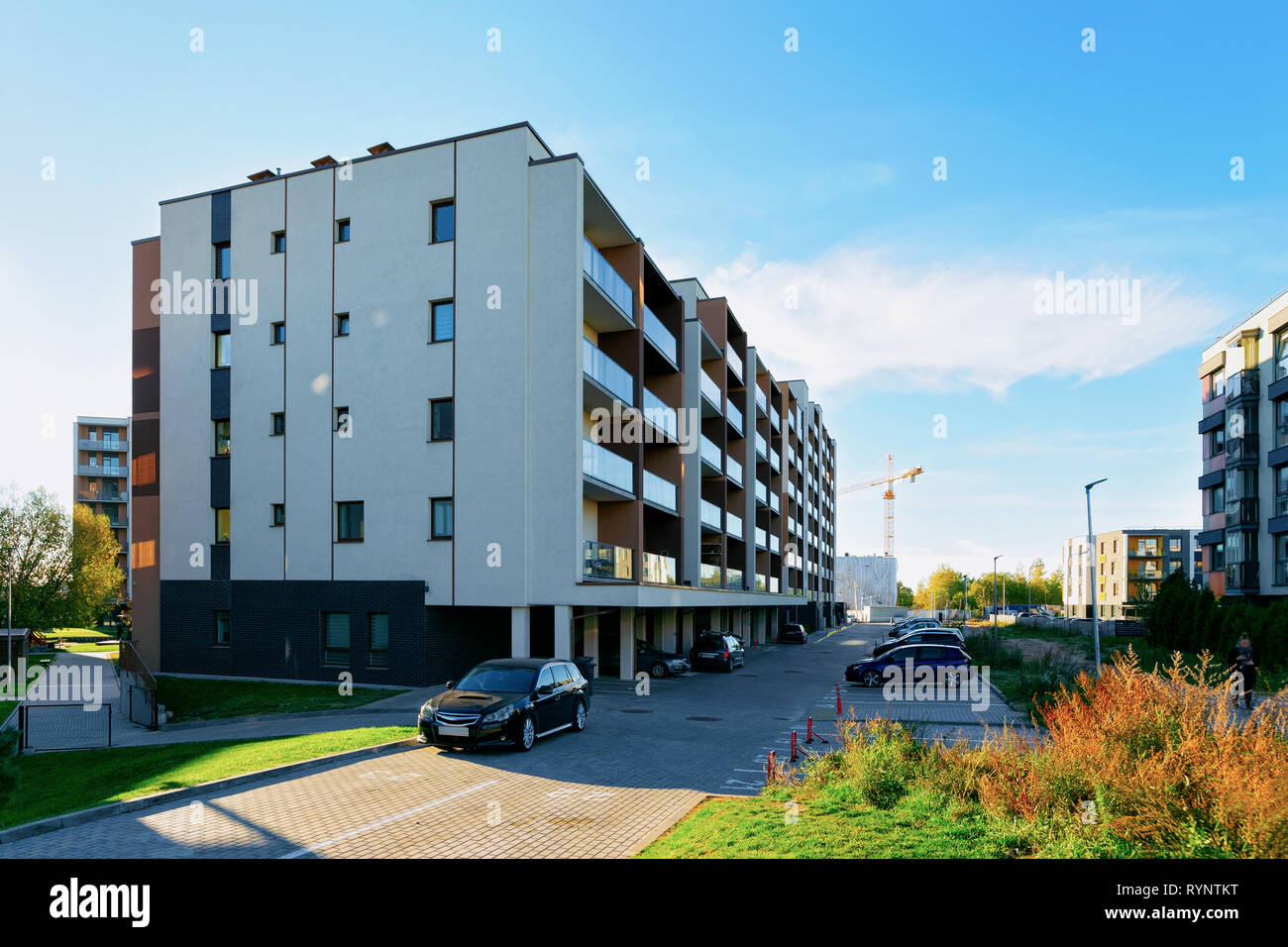 Apartment home residential building and cars parked in the street Stock ...