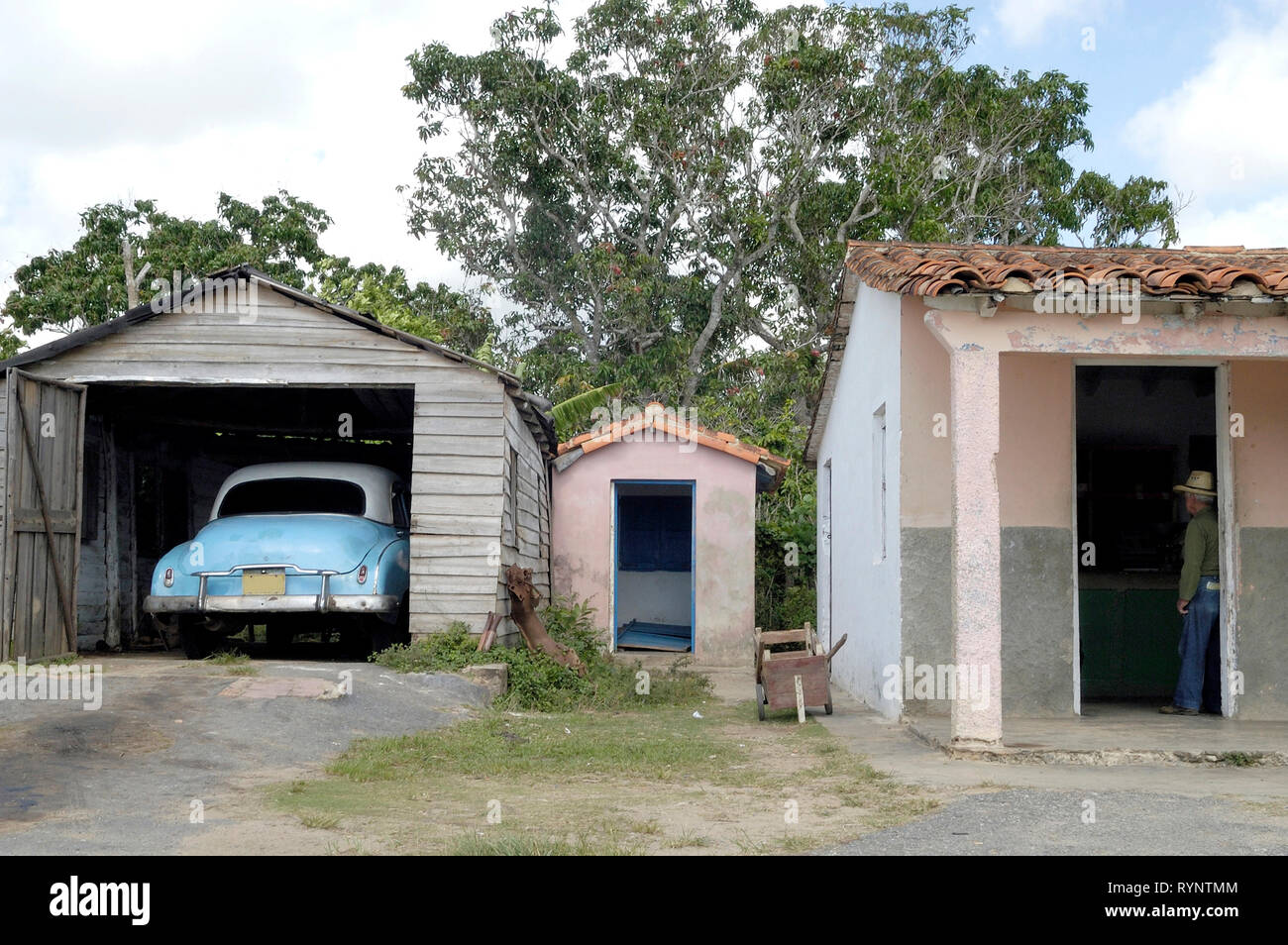 Vinales Pinar Del Rio,Cuba-September 23, 2016: Vintage car in a garage next to a small farmhouse in Vinales Pinar del Río Province Cuba Latin America Stock Photo