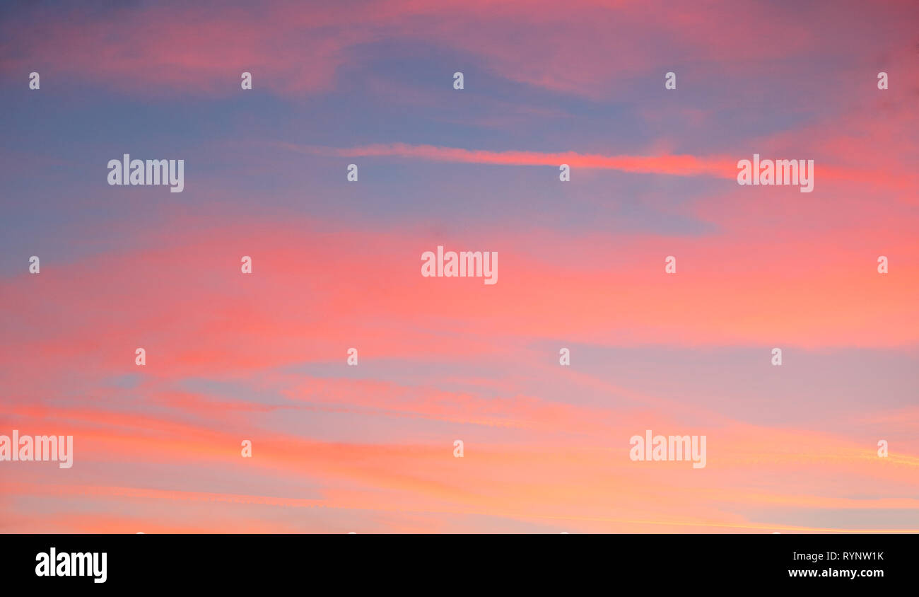 Red sky with blue clouds Stock Photo