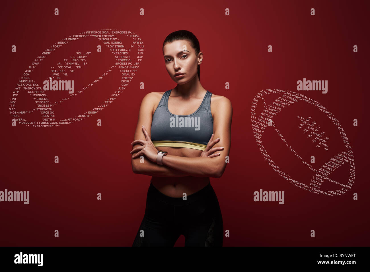 Portrait of caucasian dark-haired girl in sportswear looking at the camera. She is going to train. Body goals. Creative rugby balls painted on the background. Horizontal shot. Front view Stock Photo