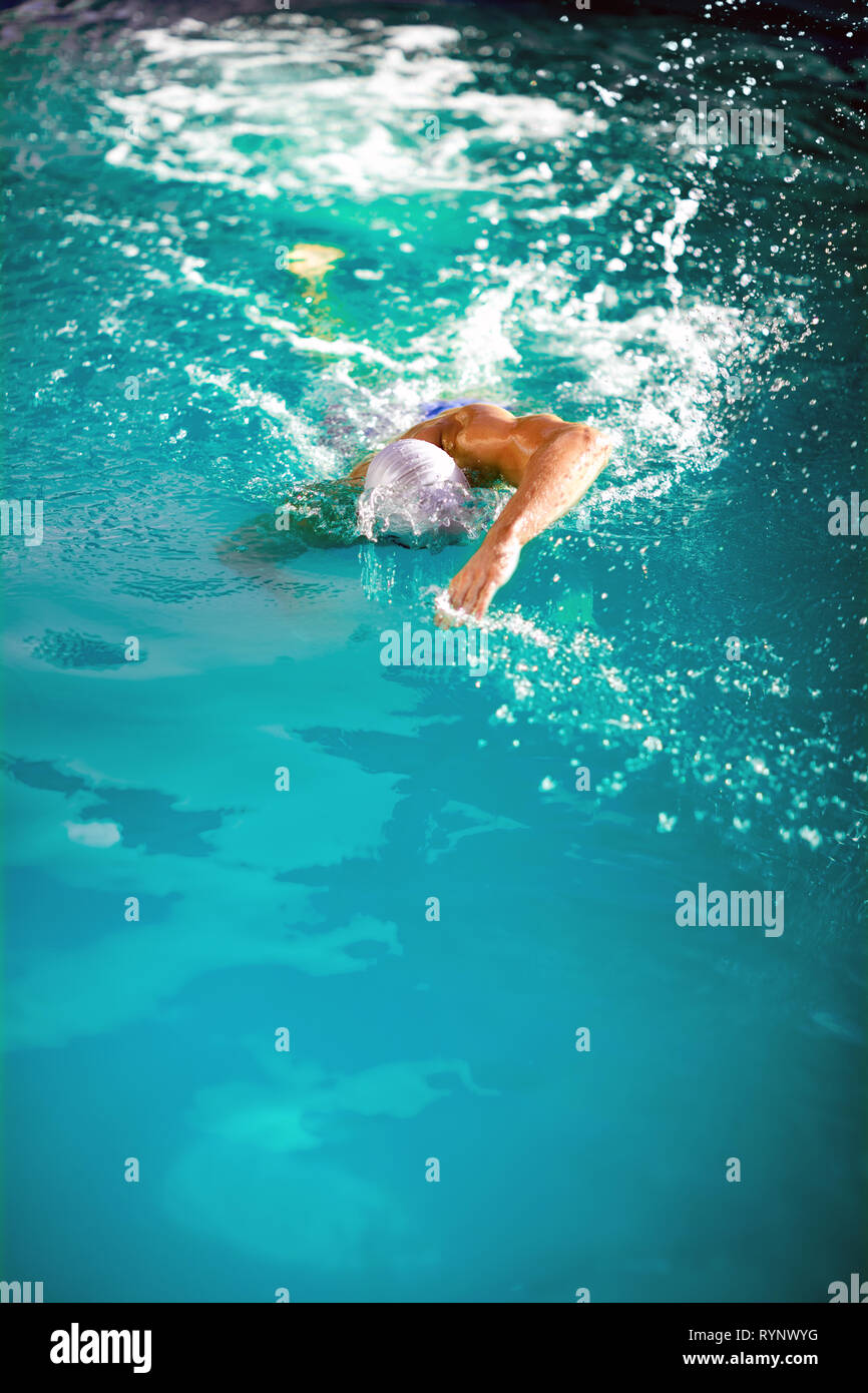 health and fitness lifestyle concept with young athlete swimmer recreating on outdoor in  Olympic pool Stock Photo